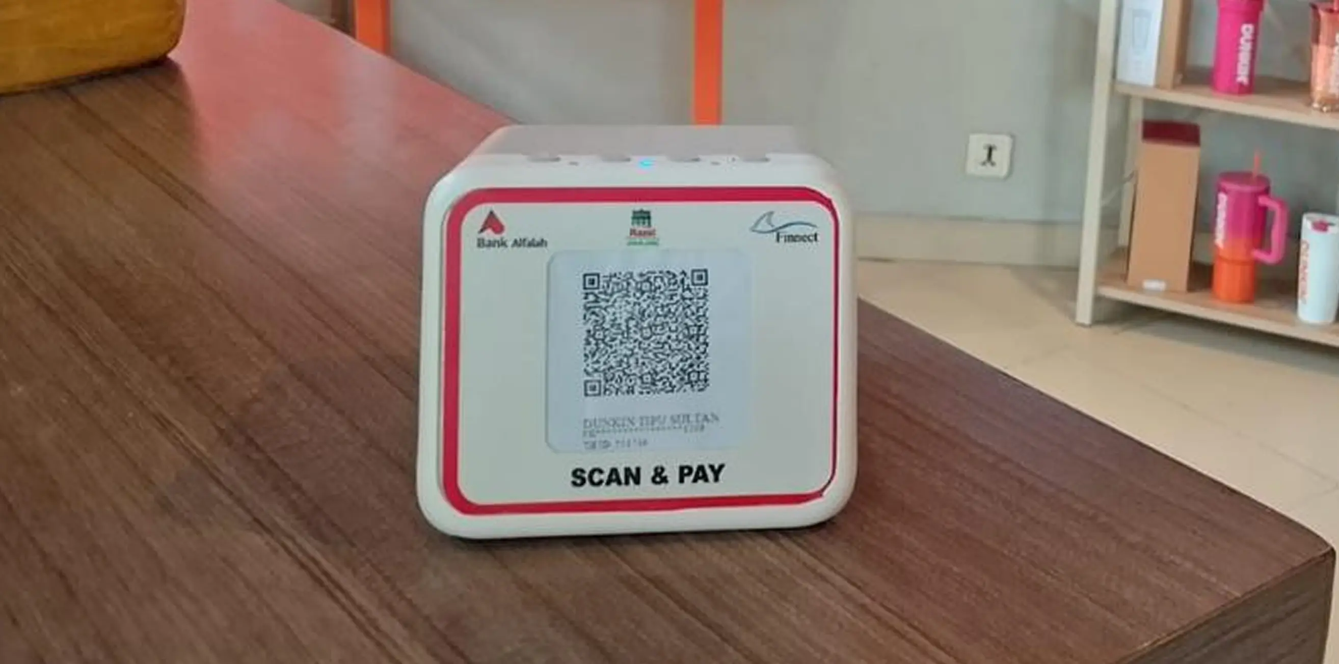 Finnect Scan & Pay Here terminal on the counter at dunkin donuts